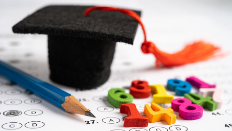 Image of education tools and graduate cap