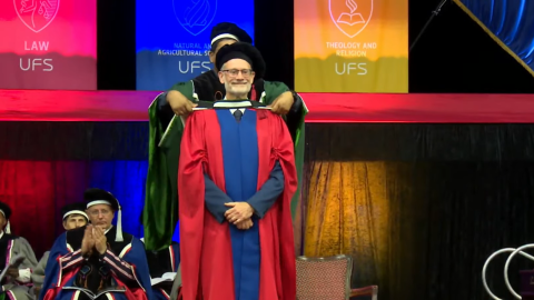Photo of Prof. Murray Leibbrandt receiving honorary degree from University of Free State
